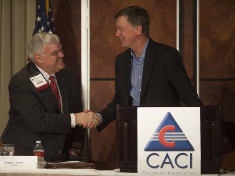 Governor Hickenlooper (right) shakes hands with Chuck Berry, CACI President.