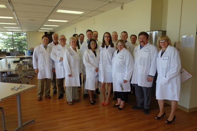 CACI members and staff touring Carestream Health facility in Windsor